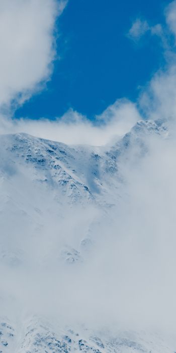 Обои 720x1440 горы, снег, облака