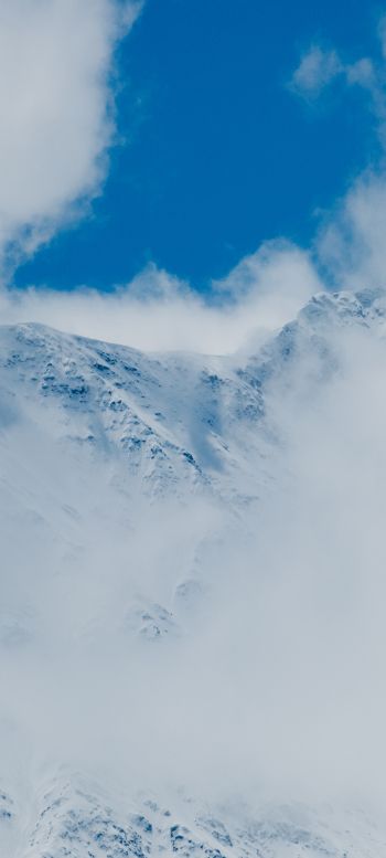 Обои 720x1600 горы, снег, облака