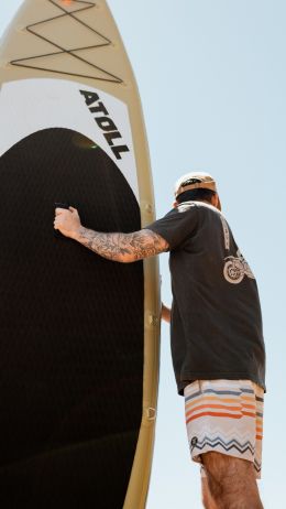 guy and surfer board Wallpaper 750x1334