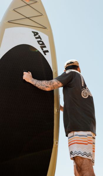 guy and surfer board Wallpaper 600x1024