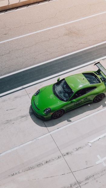 Обои 1440x2560 зеленый автомобиль