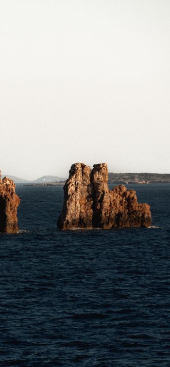 Greece, rocks in the sea Wallpaper 1284x2778