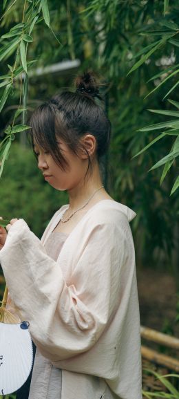 Oriental girl in the forest Wallpaper 1440x3200